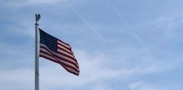 flagpole bearing the American Flag on a clear day