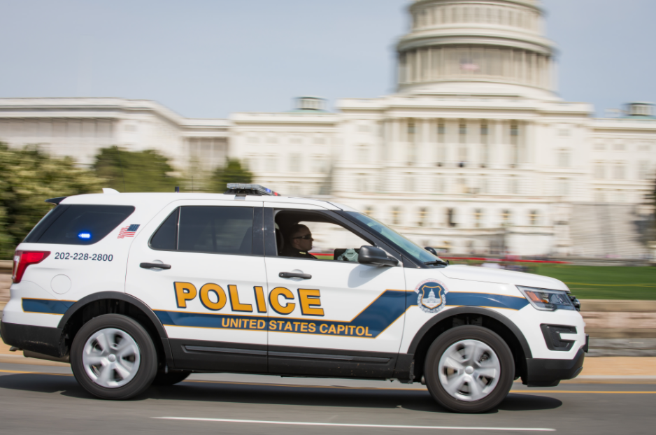 a US Capitol Police car in front of the Capitol building