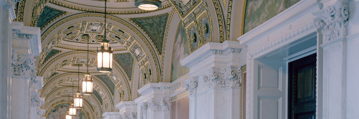 Hallway in the Library of Congress with vaulted ceilings and lanterns hanging from archways