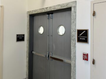 Closed double doors leading to a staircase