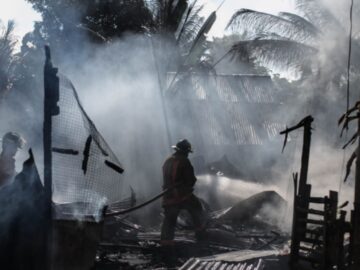 Image of firefighters in a smoky disaster zone
