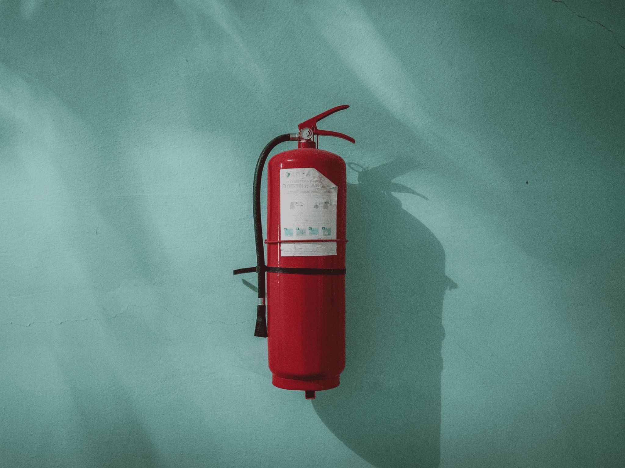 portable fire extinguisher on the wall