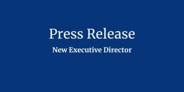 Text on blue background that reads: "Press Release: New Executive Director"