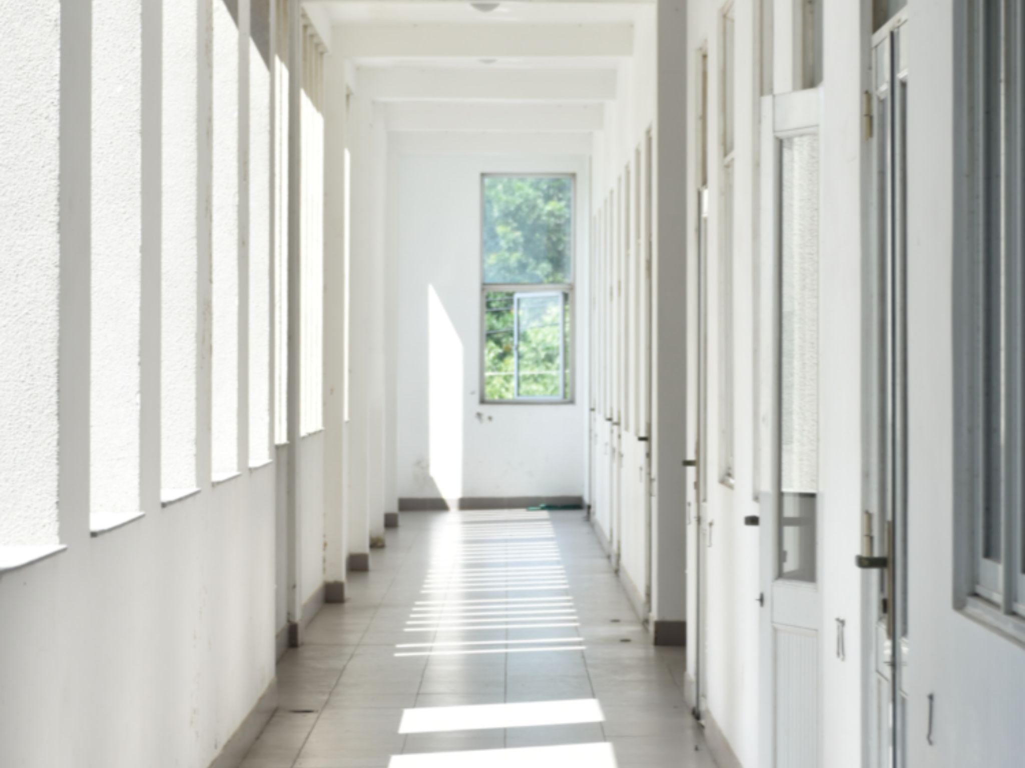 an empty white hallway